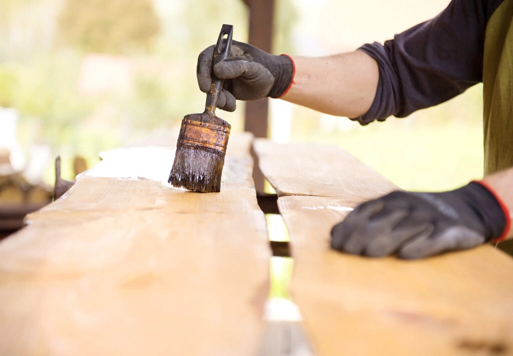 Varnishing the fences- Stock and Noble